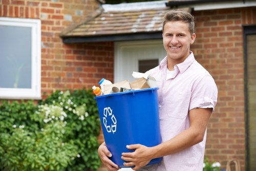 Workers managing construction debris during waste clearance